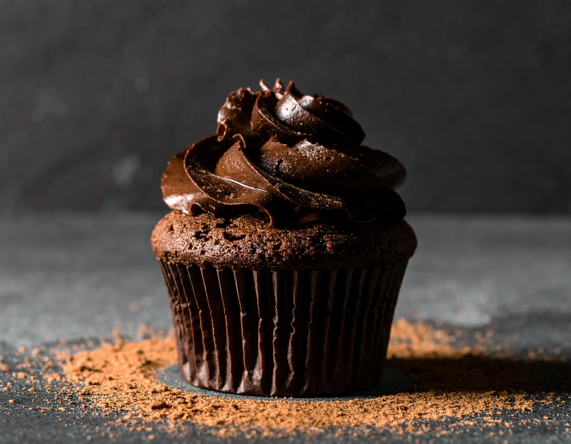 Firefly_A single chocolate cupcake topped with rich swirls of dark chocolate frosting and a s 52521 (1)
